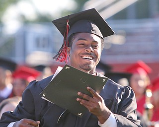        ROBERT K. YOSAY  | THE VINDICATOR...over 60 Graduates of Campbell High School received their diplomas at the John Knapic Stadium...Happy  Graduate as Estrella Gomez smiles and heads back after receiving his diploma