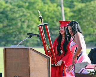        ROBERT K. YOSAY  | THE VINDICATOR...over 60 Graduates of Campbell High School received their diplomas at the John Knapic Stadium...Big moment as Samantha Koullias (valedictorian)  receives the leadership award for the most scholarships from principal Ms Jacquelyn Hampton