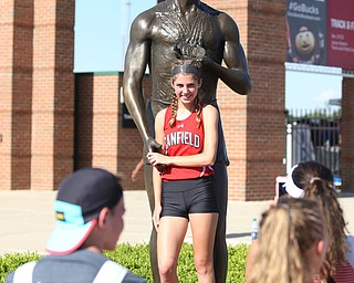 Camryn Kohout(720) of Canfield poses for photos in front of the Jesse Owens statue after competing in the DI girls 4 x 800 meter relay final during the 2017 OHSAA Boys and Girls State Track and Field Tournaments, Friday, June 2, 2017 at the Jesse Owens Memorial Stadium in Columbus...(Nikos Frazier | The Vindicator)