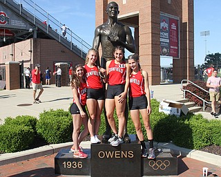 Camryn Kohout(720) of Canfield poses for photos in front of the Jesse Owens statue after competing in the DI girls 4 x 800 meter relay final during the 2017 OHSAA Boys and Girls State Track and Field Tournaments, Friday, June 2, 2017 at the Jesse Owens Memorial Stadium in Columbus...(Nikos Frazier | The Vindicator)