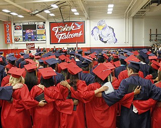             ROBERT  K. YOSAY | THE VINDICATOR..Austintown Fitch High School graduated over 300 students in the Fitch Gym Saturday morning as the graduation season is coming to a close..and the alma mater is played graduates sway and put arms around each other