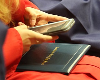             ROBERT  K. YOSAY | THE VINDICATOR..Austintown Fitch High School graduated over 300 students in the Fitch Gym Saturday morning as the graduation season is coming to a close..part of the new generation as a student shoots her diploma for  sharing on socail media
