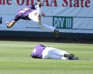 Champion Golden Flashes shortstop Lucas Nasonti (15) and Champion Golden Flashes center fielder Will Kovach (3) collide after a catch in the second inning as Champion takes on Berlin Hiland in the DIII baseball championship, Saturday, June 3, 2017 at Huntington Park in Columbus. Champion won 1-0...(Nikos Frazier | The Vindicator)