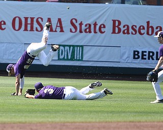 Champion Golden Flashes second baseman Justin Taninecz (2) watches on as Champion Golden Flashes shortstop Lucas Nasonti (15) and Champion Golden Flashes center fielder Will Kovach (3) collide after a catch in the second inning as Champion takes on Berlin Hiland in the DIII baseball championship, Saturday, June 3, 2017 at Huntington Park in Columbus. Champion won 1-0...(Nikos Frazier | The Vindicator)