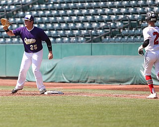 Champion Golden Flashes first baseman AJ Meyer (25) waits for the out as Hiland Hawks batter Ryan Yoder(2) runs towards first in the third inning as Champion takes on Berlin Hiland in the DIII baseball championship, Saturday, June 3, 2017 at Huntington Park in Columbus. Champion won 1-0...(Nikos Frazier | The Vindicator)