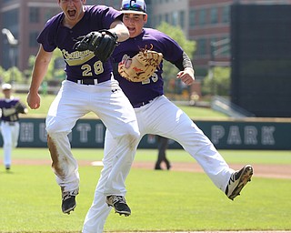 Champion Golden Flashes pitcher Andrew Russel (28) and Champion Golden Flashes first baseman AJ Meyer (25) celebrate the third out in the sixth inning as Champion takes on Berlin Hiland in the DIII baseball championship, Saturday, June 3, 2017 at Huntington Park in Columbus. Champion won 1-0...(Nikos Frazier | The Vindicator)