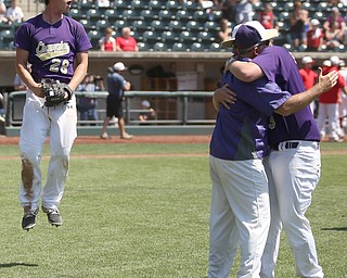 Champion Golden Flashes pitcher Andrew Russel (28)(left) jumps up coach Rick Yauger hugs Champion Golden Flashes center fielder Will Kovach (3) Champion celebrate after defeating Berlin Hiland, 1-0 in the DIII baseball championship, Saturday, June 3, 2017 at Huntington Park in Columbus. Champion won 1-0...(Nikos Frazier | The Vindicator)