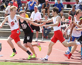 Connor McKee(106) hands off the baton to Quilan Rumsey(109) of Salem while competing in the DII boys 4 x 400 meter relay final during the 2017 OHSAA Boys and Girls State Track and Field Tournaments, Saturday, June 3, 2017 at the Jesse Owens Memorial Stadium in Columbus...(Nikos Frazier | The Vindicator)