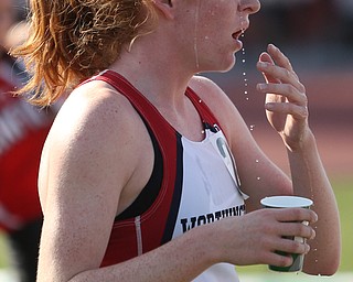 Gia Napoleon(506) of Worthington throws water on her face after competing in the DI girls 800 meter run final during the 2017 OHSAA Boys and Girls State Track and Field Tournaments, Saturday, June 3, 2017 at the Jesse Owens Memorial Stadium in Columbus...(Nikos Frazier | The Vindicator)