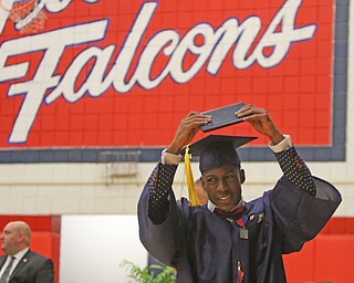             ROBERT  K. YOSAY | THE VINDICATOR..Austintown Fitch High School graduated over 300 students in the Fitch Gym Saturday morning as the graduation season is coming to a close..Marquis Barbel.. raises his diploma over his head after getting the diploma