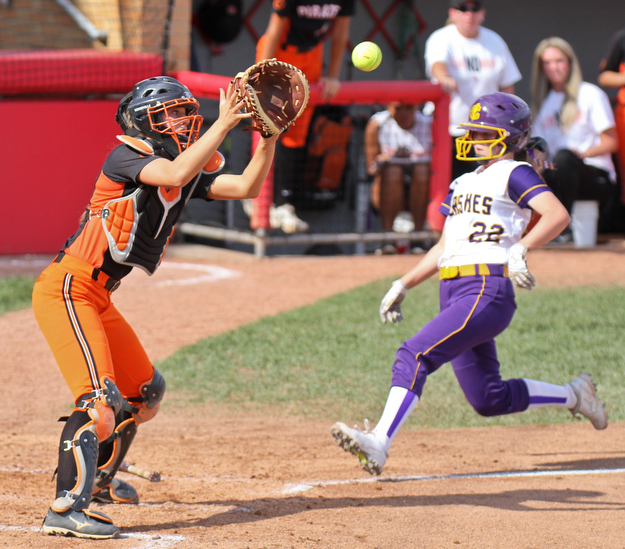 William D Lewis The Vindicator  Champion's Carli Swipas (22) beats the throw and scores while Wheelersburg catcher Kasey Bergan waits for the ball.