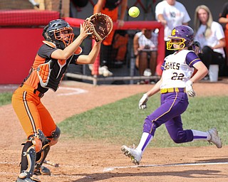 William D Lewis The Vindicator  Champion's Carli Swipas (22) beats the throw and scores while Wheelersburg catcher Kasey Bergan waits for the ball.