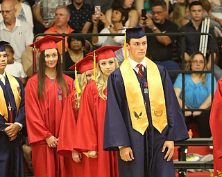             ROBERT  K. YOSAY | THE VINDICATOR..Austintown Fitch High School graduated over 300 students in the Fitch Gym Saturday morning as the graduation season is coming to a close..time for diplomas as student  line up