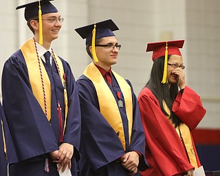             ROBERT  K. YOSAY | THE VINDICATOR..Austintown Fitch High School graduated over 300 students in the Fitch Gym Saturday morning as the graduation season is coming to a close..Valedictorians share a chuckle  as Christopher Gerberry Jacob Rodesh and chuckling is Wendy Liu