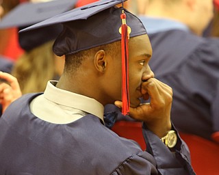            ROBERT  K. YOSAY | THE VINDICATOR..Austintown Fitch High School graduated over 300 students in the Fitch Gym Saturday morning as the graduation season is coming to a close..deep in thought as valedictorians speak...Allan Mukaabya