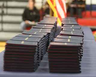             ROBERT  K. YOSAY | THE VINDICATOR..Austintown Fitch High School graduated over 300 students in the Fitch Gym Saturday morning as the graduation season is coming to a close..Diplomas piled up at the ready