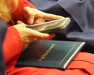             ROBERT  K. YOSAY | THE VINDICATOR..Austintown Fitch High School graduated over 300 students in the Fitch Gym Saturday morning as the graduation season is coming to a close..part of the new generation as a student shoots her diploma for  sharing on socail media