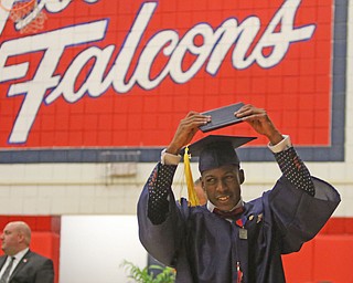             ROBERT  K. YOSAY | THE VINDICATOR..Austintown Fitch High School graduated over 300 students in the Fitch Gym Saturday morning as the graduation season is coming to a close..Marquis Barbel.. raises his diploma over his head after getting the diploma