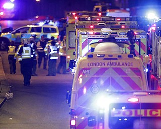 Emergency personnel on London Bridge after an incident in central London, Saturday, June 3, 2017. British police said they were dealing with "incidents" on London Bridge and nearby Borough Market in the heart of the British capital Saturday, as witnesses reported a vehicle veering off the road and hitting several pedestrians. (Dominic Lipinski/PA via AP)
