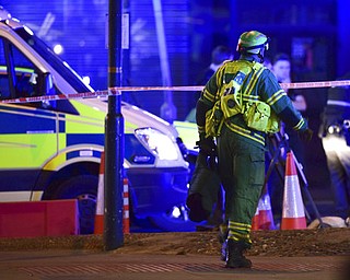 A paramedic rushes to the scene after an incident in central London, Saturday, June 3, 2017.  British police said they were dealing with "incidents" on London Bridge and nearby Borough Market in the heart of the British capital Saturday, as witnesses reported a vehicle veering off the road and hitting several pedestrians. (Dominic Lipinski/PA via AP)