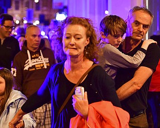 People run down Borough High Street as police are dealing with an incident on London Bridge in London, Saturday, June 3, 2017.    Transport for London Says London Bridge closed in both directions due to police activity. (Dominic Lipinski/PA via AP)