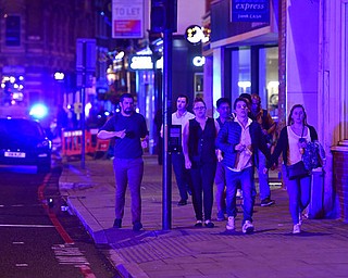 People run down Borough High Street as police are dealing with a "major incident" at London Bridge in London, Saturday, June 3, 2017. (Dominic Lipinski/PA via AP)