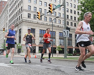 William D Lewis The Vindicator  Runners make their way through downtown during Youngstown Marathon 6-4-17.