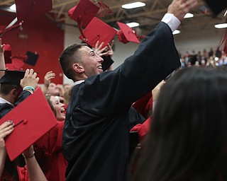 Jake Cummings throws his mortarboard into the air during the Canfield High School commencement, Sunday, June 4, 2017 in Canfield...(Nikos Frazier | The Vindicator)