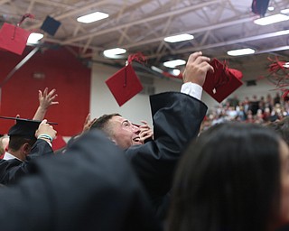 Jake Cummings throws his mortarboard into the air during the Canfield High School commencement, Sunday, June 4, 2017 in Canfield...(Nikos Frazier | The Vindicator)
