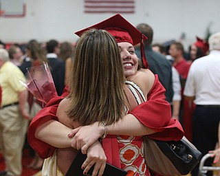 Mallory Jones hugs her mother, Bethanie, after the Canfield High School commencement, Sunday, June 4, 2017 in Canfield...(Nikos Frazier | The Vindicator)