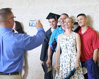 (from Left) Graduate Matt Nielson with his dad, Eric, sister, Erica and brother, PatricK after the Canfield High School commencement, Sunday, June 4, 2017 in Canfield...(Nikos Frazier | The Vindicator)