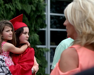 Gabby Scianna holds her little sister, Sophia, after the Canfield High School commencement, Sunday, June 4, 2017 in Canfield...(Nikos Frazier | The Vindicator)
