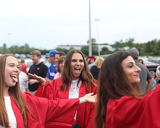 Rebecca Armstrong(center) takes a selfie with her friends, Lena Angelilli(right) and Cailin Shindle after the Canfield High School commencement, Sunday, June 4, 2017 in Canfield...(Nikos Frazier | The Vindicator)