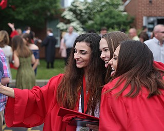 (from left) Lena Angelilli, Cailin Shindle and Rebecca Armstrong take a selfie after the Canfield High School commencement, Sunday, June 4, 2017 in Canfield...(Nikos Frazier | The Vindicator)