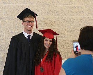 Austin Householder and Lexi Denney pose for photos after the Canfield High School commencement, Sunday, June 4, 2017 in Canfield...(Nikos Frazier | The Vindicator)