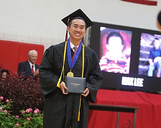             ROBERT  K. YOSAY | THE VINDICATOR..Canfield High School Gym  as class of 2017 graduates.Max Lee...  Top honors