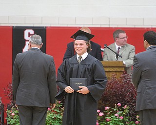             ROBERT  K. YOSAY | THE VINDICATOR..Canfield High School Gym  as class of 2017 graduates..Zachery Bernat  all smiles after receiving his diploma