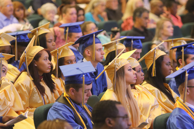             ROBERT  K. YOSAY | THE VINDICATOR..Valley Christian graduated over 50 students  at Highway Tabernacle Church in Austintown Sunday afternoon...Listeing to the valedictorians...