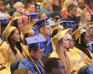             ROBERT  K. YOSAY | THE VINDICATOR..Valley Christian graduated over 50 students  at Highway Tabernacle Church in Austintown Sunday afternoon...Listeing to the valedictorians...