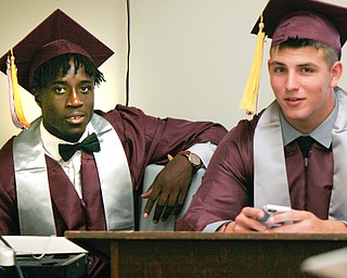 William D. Lewis the Vindicator  Boardman grads Koby Adu-Poku, left, and Jordan Acevedo pause before commencement June 4, 2017 at BHS.