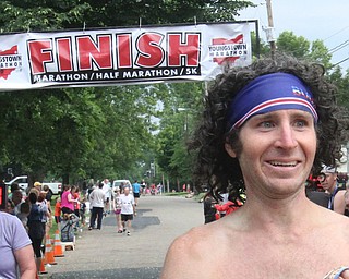 William D Lewis The Vindicator  Youngstown Marathon runner Scooby Bolha of Austintown at finish.