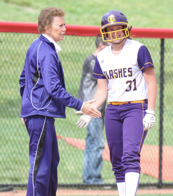 William D Lewis The Vindicator Champion's Molly Williams(31) of the Trumbull team gets congrats from coach Cheryl Weaver after slamming a triple in 1rst inning  during 1rst game of 14th annual Bill Sferra Softball Classic at YSU 6-6-17.