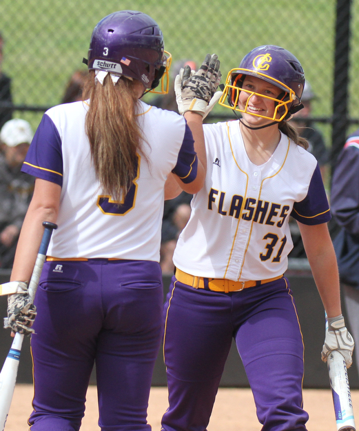 William D Lewis The Vindicator Champion's Molly Williams(31) of the Trumbull team gets congrats from McKenzie Zigmont(3)  after scoring during 1rst game of 14th annual Bill Sferra Softball Classic at YSU 6-6-17.