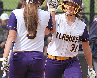 William D Lewis The Vindicator Champion's Molly Williams(31) of the Trumbull team gets congrats from McKenzie Zigmont(3)  after scoring during 1rst game of 14th annual Bill Sferra Softball Classic at YSU 6-6-17.