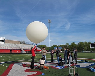 Neighbors | Alexis Bartolomucci.The eighth-grade Austintown Middle School STEM students got ready to release the weather balloon during the launch on May 10 at the Austintown Fitch football stadium.