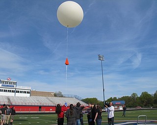 Neighbors | Alexis Bartolomucci.The weather balloon was slowly released into the air by the eighth-grade STEM students from Austintown Middle School.