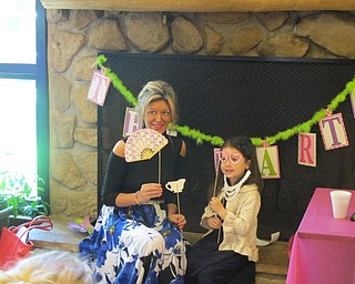 Neighbors | Alexis Bartolomucci.Props were set out for mothers and their daughters to use for pictures on May 7 at the Mommy and Me for Tea event at Boardman Park.