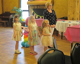 Neighbors | Alexis Bartolomucci.The girls waited in line as they prepared to walk the runway for the annual Mommy and Me for Tea Fashion Show at Boardman Park.