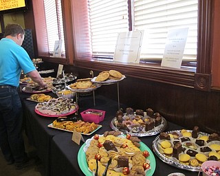 Neighbors | Alexis Bartolomucci.Guests at the Chocolate Fest at the Magic Tree in Boardman went through the chocolate buffet line picking out different chocolate snacks.