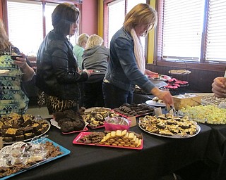 Neighbors | Alexis Bartolomucci.Guests lined up as they picked out different chocolate treats during the second annual Chocolate Fest hosted by the Piggyback Foundation of Youngstown on May 11.
